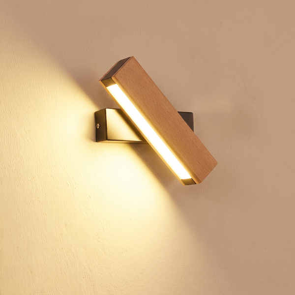 Rowan Wall Sconce mounted on a wall, LED light on