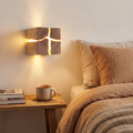 WoodAura wall light in hand carved solid wood and resin