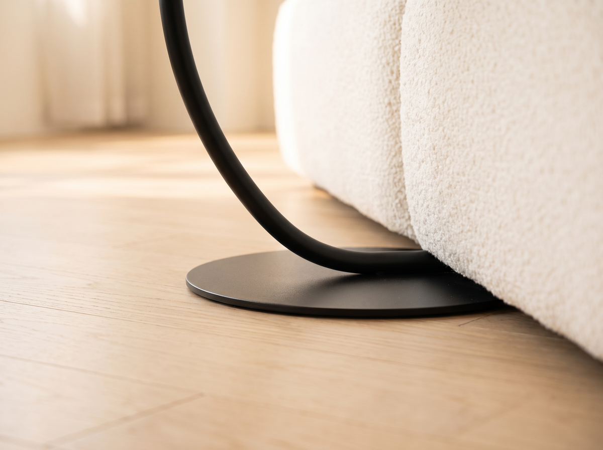 Orla Curve Side Table base sliding under a sofa