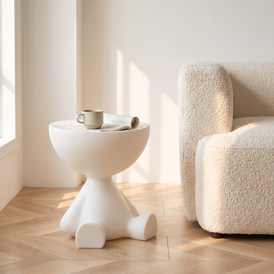 Mila Side Table in Milky White beside a cream sofa