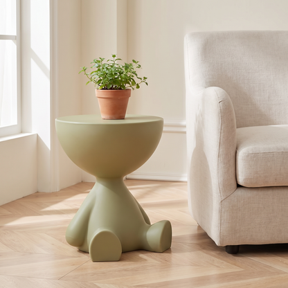 Mila Side Table in Olive Green next to an armchair
