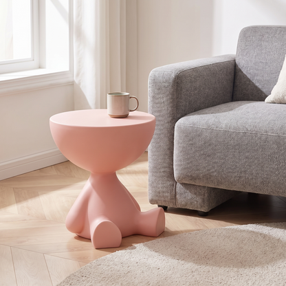 Mila Side Table in Blush Pink beside a grey sofa