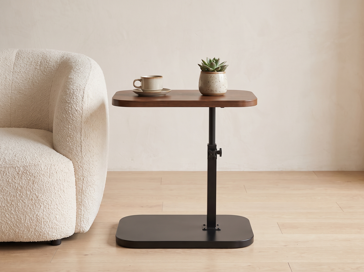 Ezra side table beside an armchair in a small flat