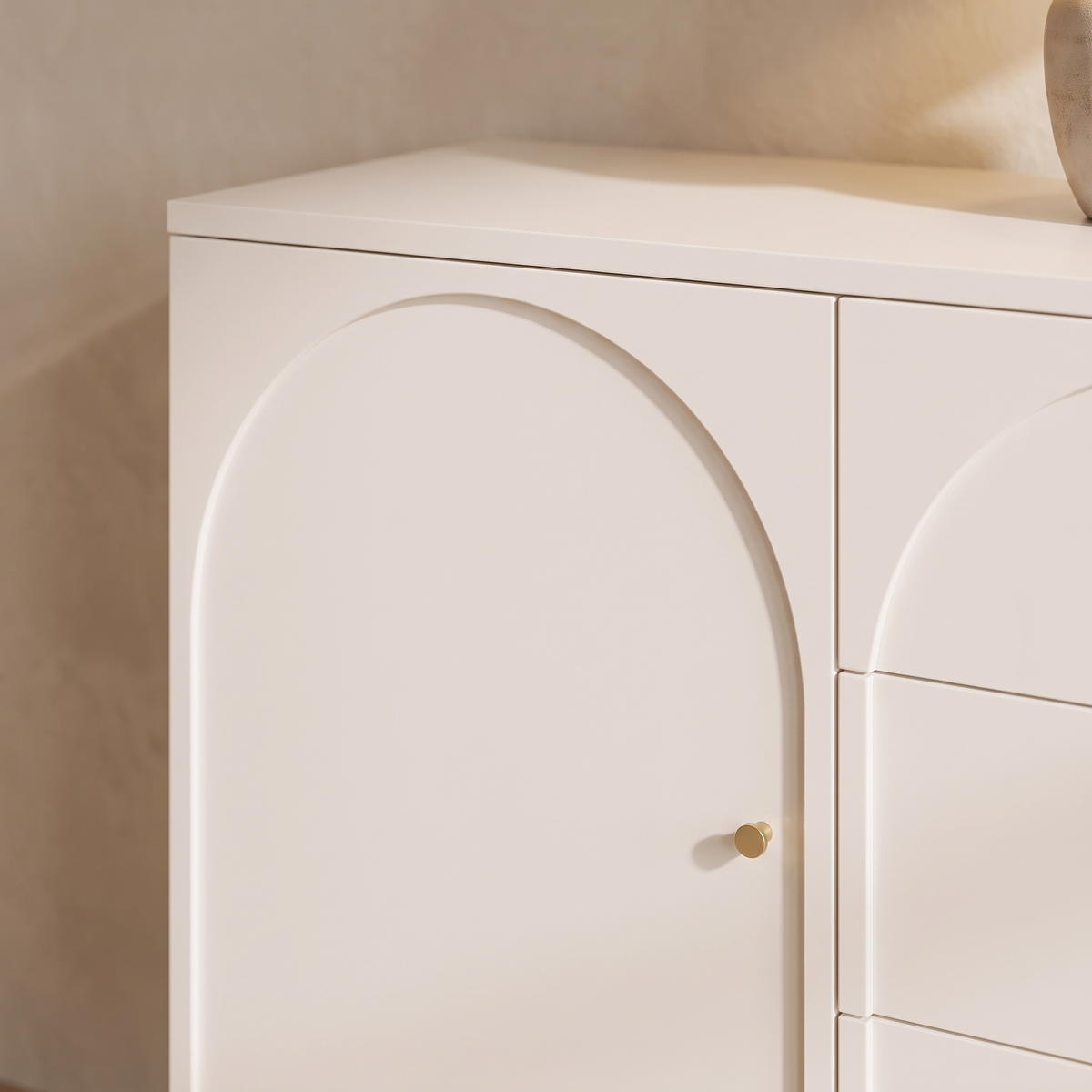 Close up of the arched door detail and gold knob