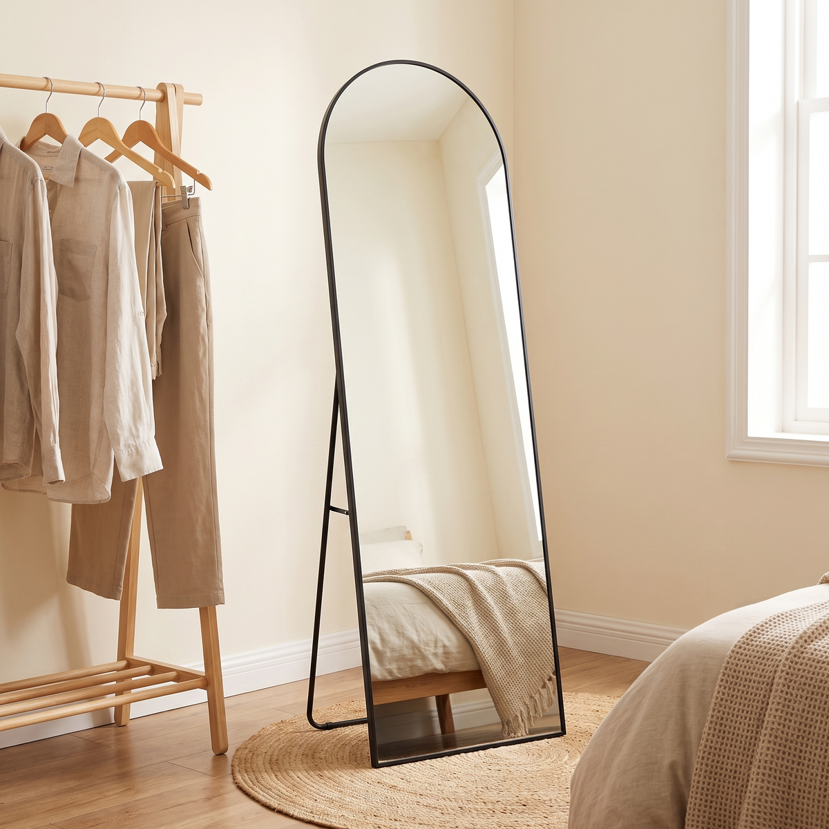 Aria black arched mirror standing on its back leg