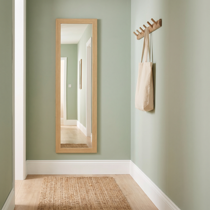 Hazel mirror hung on a hallway wall