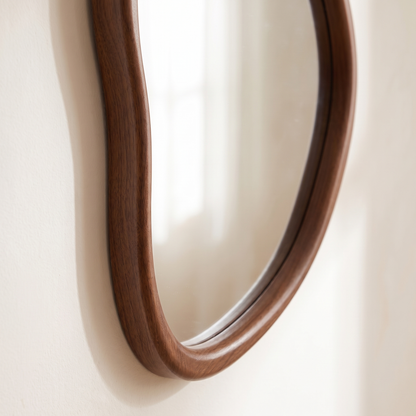 Close up of the rounded coffee brown wooden frame