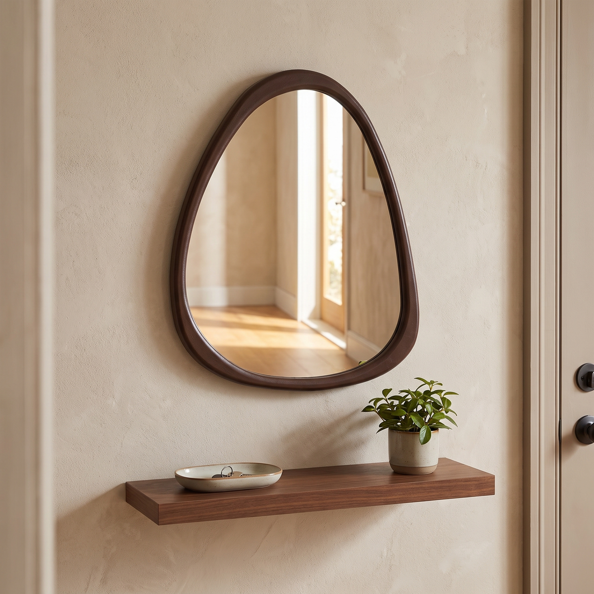 Isla brown pebble mirror in a hallway