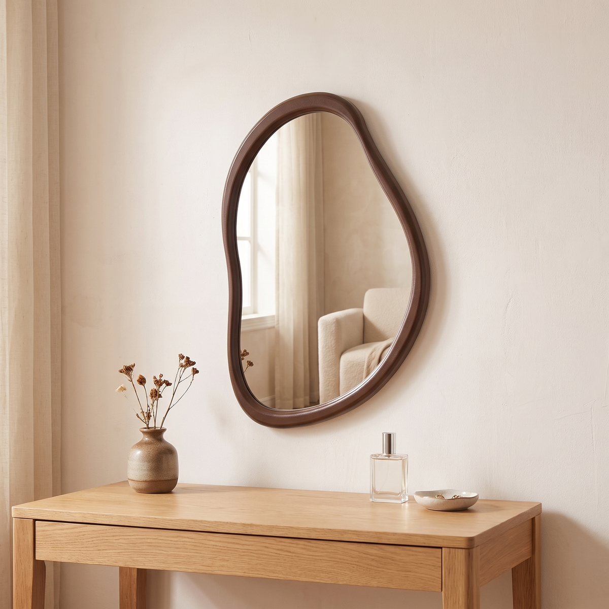 Nils irregular wooden wall mirror above a dressing table